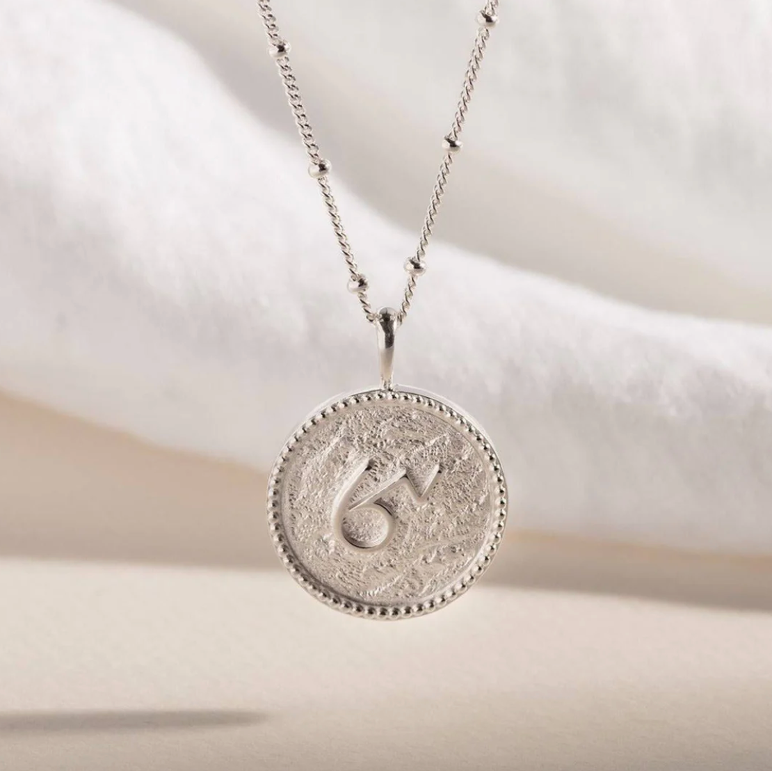 CLAIRE HILL DESIGNS "BRAVE" SHORTHAND COIN NECKLACE