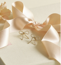 ESTELLA BARTLETT BOW TENNIS CHAIN EARRINGS