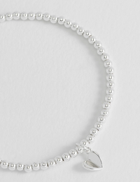 ESTELLA BARTLETT FOLDED HEART BEADED BRACELET