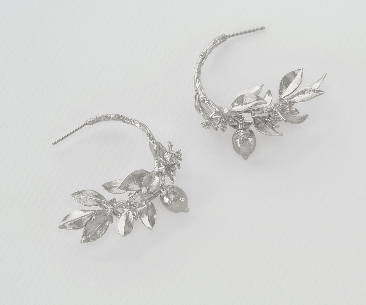 Alex Monroe lemon blossom branch hoop earrings.