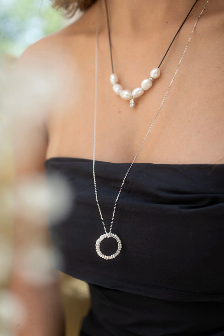 CLAUDIA BRADBY CIRCLE OF LIFE LONG PEARL PENDANT NECKLACE