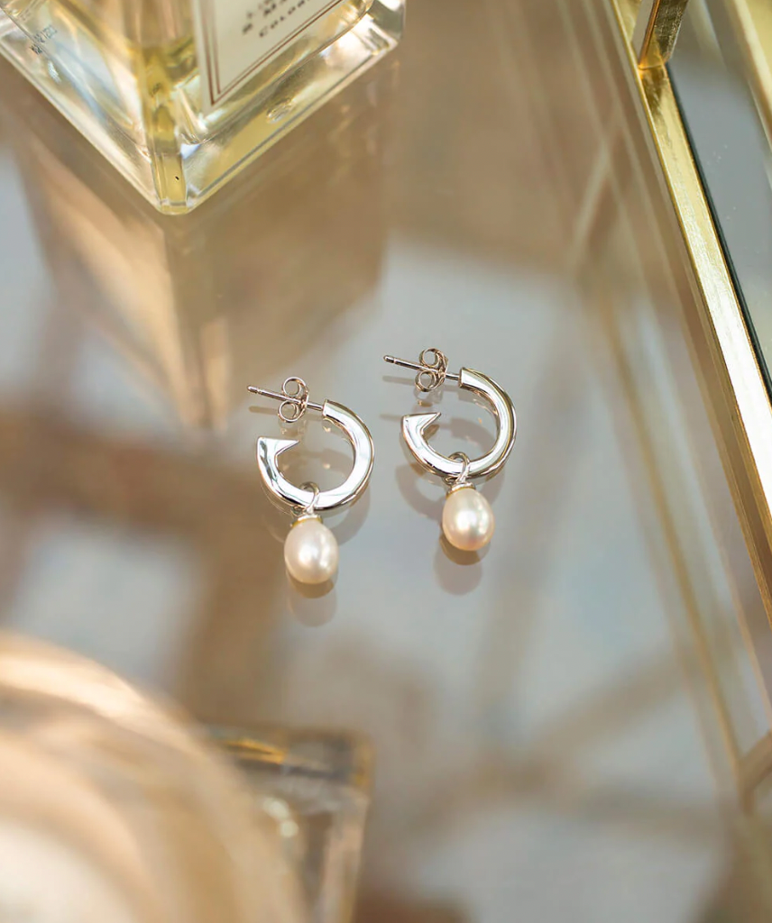 CLAUDIA BRADBY BIOGRAPHY PEARL HOOP EARRINGS